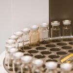 Glass vials arranged on machine, courtesy of Jess Loiterton